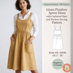 Woman wearing mustard linen pinafore apron dress with gathered skirt and pockets sewing pattern PDF sizes XS to XXXL
