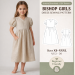 Young girl wearing beige linen bishop dress with puff sleeves and pockets, Bishop Girls Dress Sewing Pattern PDF download sizes XS-XXXL