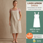 Woman wearing beige linen apron dress sewing pattern for women loose fit pinafore style over pink tee with front pockets